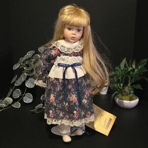 Vintage Porcelain Doll with Blue Floral Dress